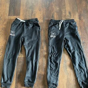TWO pairs boys large Under Armour pants.
